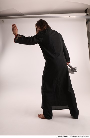Man Adult Average White Fighting without gun Standing poses Coat