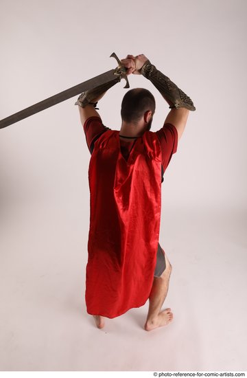 Man Adult Average White Fighting with sword Standing poses Casual