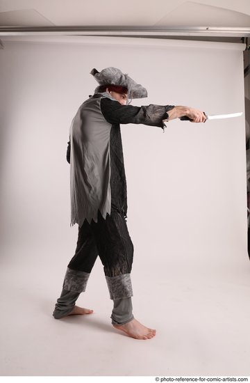 Man Adult Average White Fighting with sword Standing poses Casual