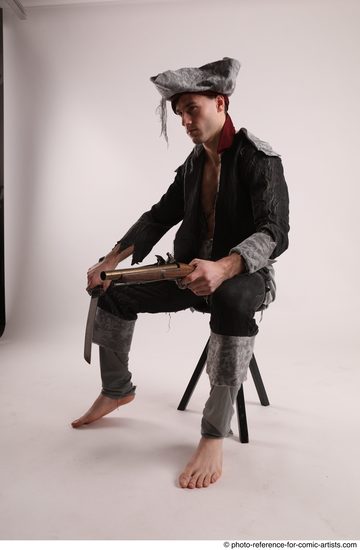 Man Adult Average White Fighting with gun Sitting poses Coat