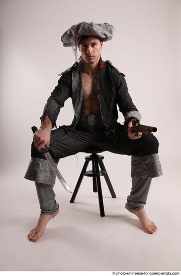 Man Adult Average White Fighting with gun Sitting poses Coat