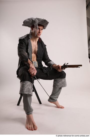 Man Adult Average White Fighting with gun Sitting poses Coat