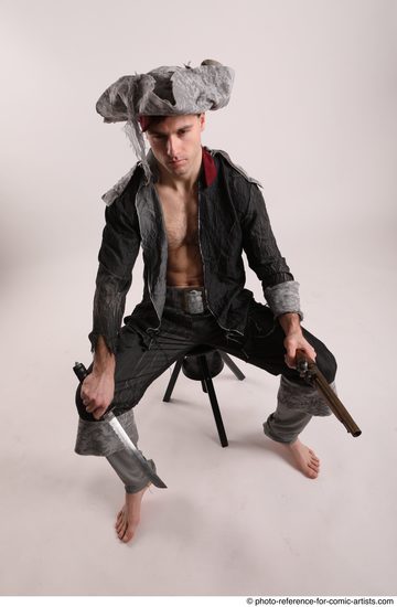 Man Adult Average White Fighting with gun Sitting poses Coat