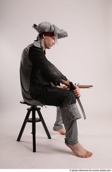 Man Adult Average White Fighting with gun Sitting poses Coat