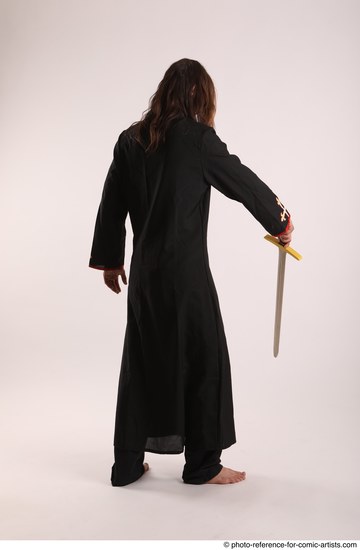 Man Adult Average White Fighting with sword Standing poses Coat