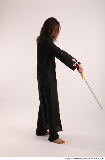 Man Adult Average White Fighting with sword Standing poses Coat