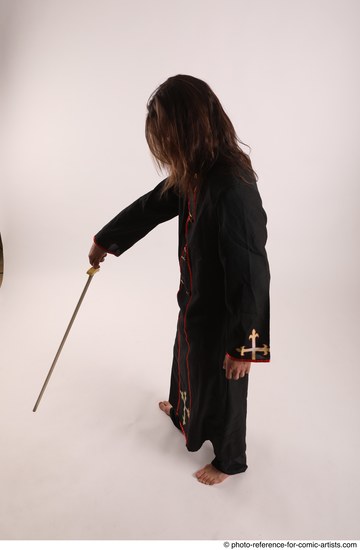 Man Adult Average White Fighting with sword Standing poses Coat