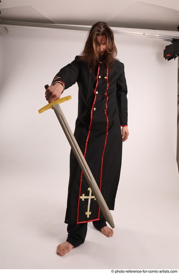 Man Adult Average White Fighting with sword Standing poses Coat