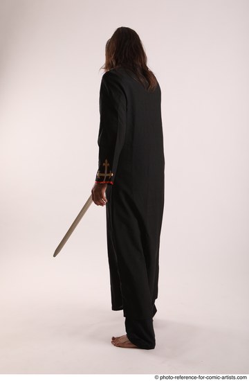 Man Adult Average White Fighting with sword Standing poses Coat