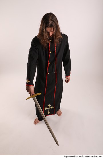 Man Adult Average White Fighting with sword Standing poses Coat