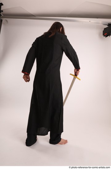 Man Adult Average White Fighting with sword Standing poses Coat