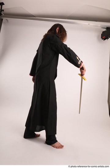 Man Adult Average White Fighting with sword Standing poses Coat