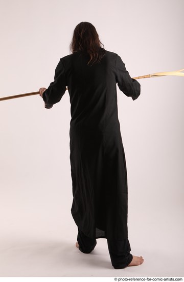 Man Adult Average White Fighting with spear Standing poses Coat