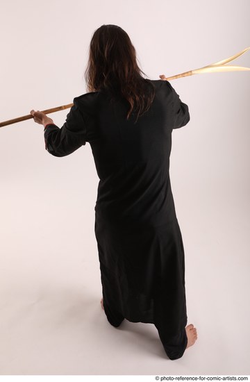 Man Adult Average White Fighting with spear Standing poses Coat