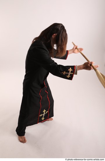 Man Adult Average White Fighting with spear Standing poses Coat