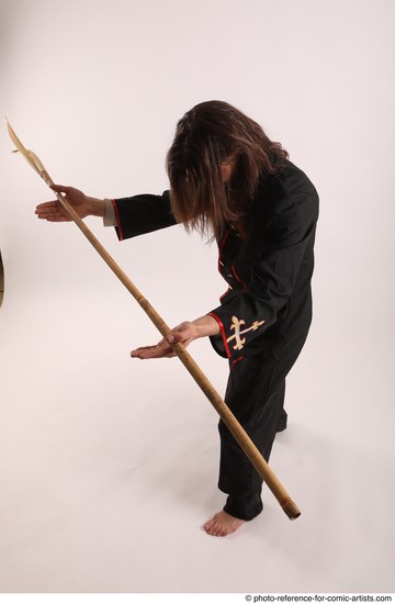 Man Adult Average White Fighting with spear Standing poses Coat