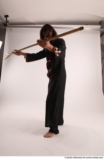 Man Adult Average White Fighting with spear Standing poses Coat