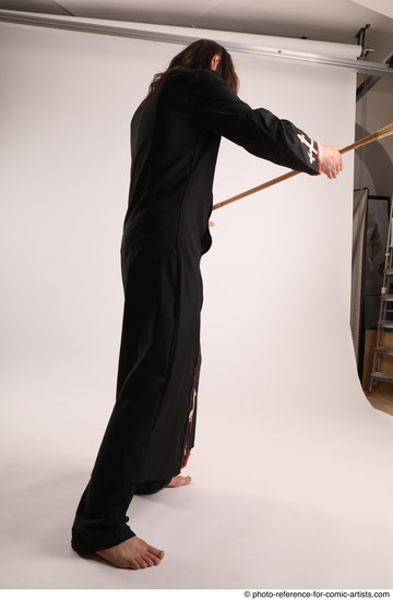 Man Adult Average White Fighting with spear Standing poses Coat