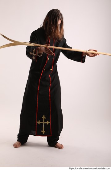 Man Adult Average White Fighting with spear Standing poses Coat