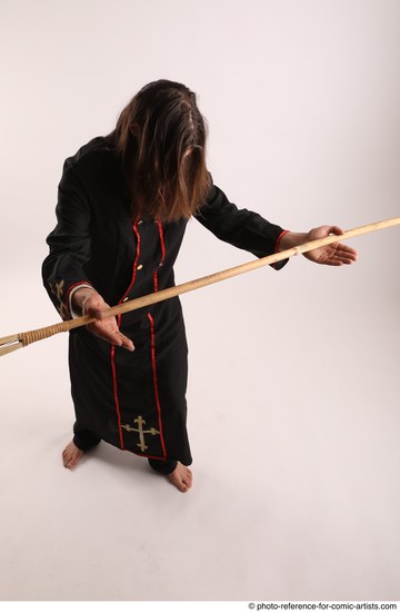 Man Adult Average White Fighting with spear Standing poses Coat