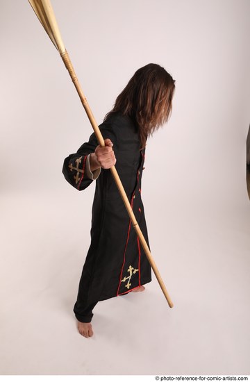 Man Adult Average White Fighting with spear Standing poses Coat