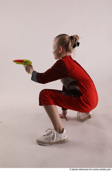 Woman Young Athletic White Fighting with gun Sitting poses Army