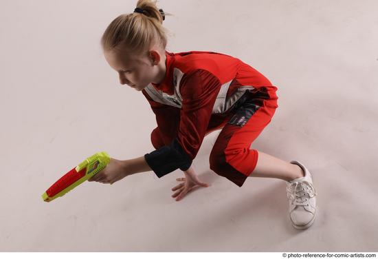 Woman Young Athletic White Fighting with gun Sitting poses Army