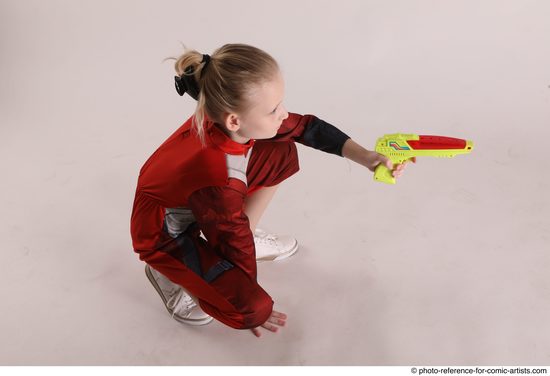 Woman Young Athletic White Fighting with gun Sitting poses Army