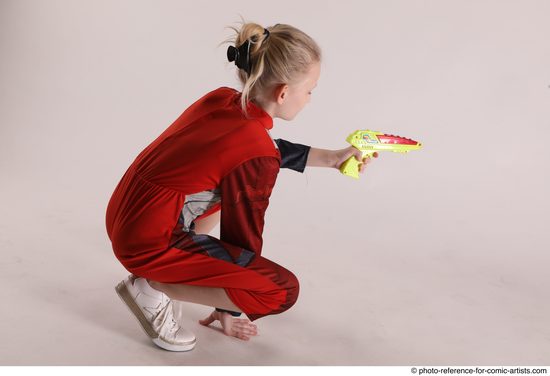 Woman Young Athletic White Fighting with gun Sitting poses Army