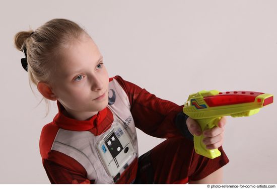 Woman Young Athletic White Fighting with gun Sitting poses Army