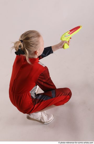 Woman Young Athletic White Fighting with gun Sitting poses Army