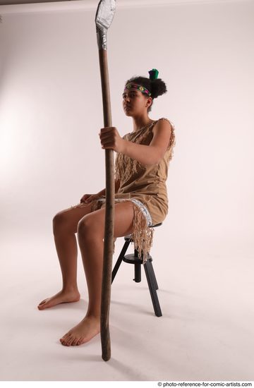 Woman Young Average Black Fighting with spear Sitting poses Casual