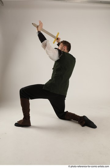 Man Adult Athletic White Fighting with sword Kneeling poses Casual