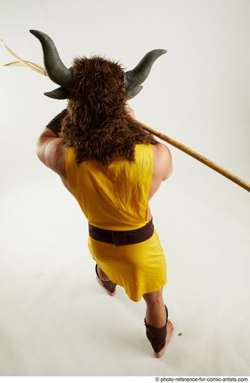 Man Adult Average White Fighting with spear Standing poses Casual