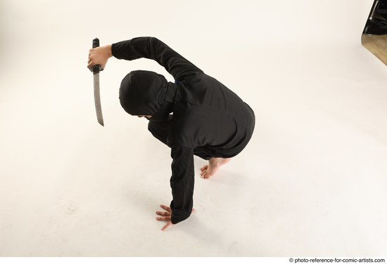 Man Young Athletic Fighting with knife Kneeling poses Casual Asian