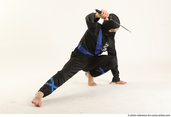 Man Young Athletic Fighting with knife Kneeling poses Casual Asian