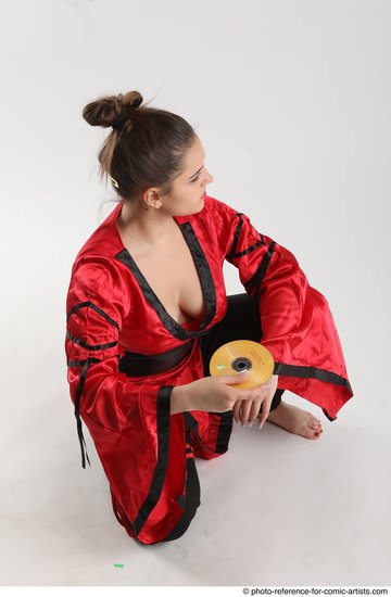 Woman Adult Average Martial art Sitting poses Coat Latino