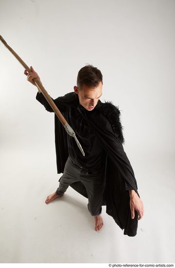 Man Adult Athletic White Fighting with spear Standing poses Coat