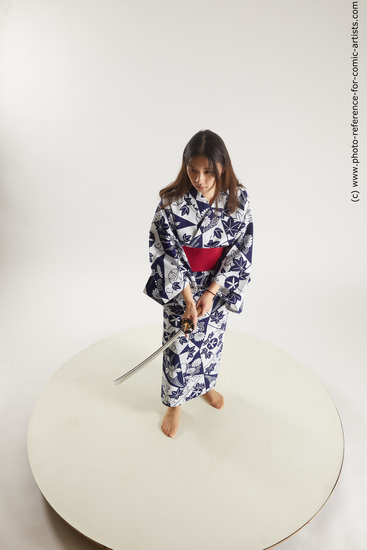 Woman Young Athletic Fighting with sword Asian Costumes