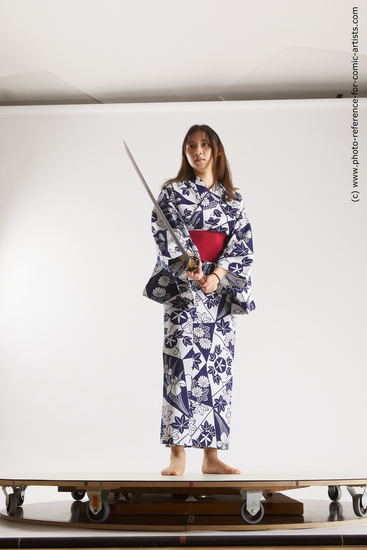 Woman Young Athletic Fighting with sword Asian Costumes