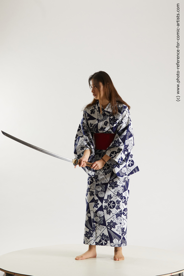 Woman Young Athletic Fighting with sword Asian Costumes