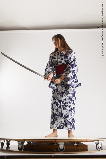 Woman Young Athletic Fighting with sword Asian Costumes