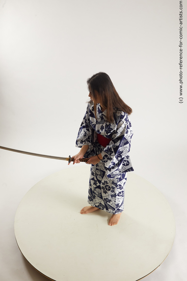 Woman Young Athletic Fighting with sword Asian Costumes