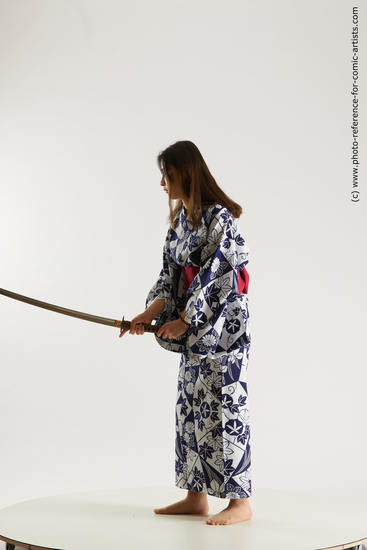 Woman Young Athletic Fighting with sword Asian Costumes