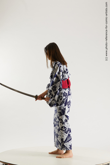 Woman Young Athletic Fighting with sword Asian Costumes