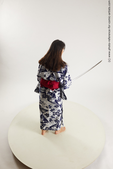 Woman Young Athletic Fighting with sword Asian Costumes