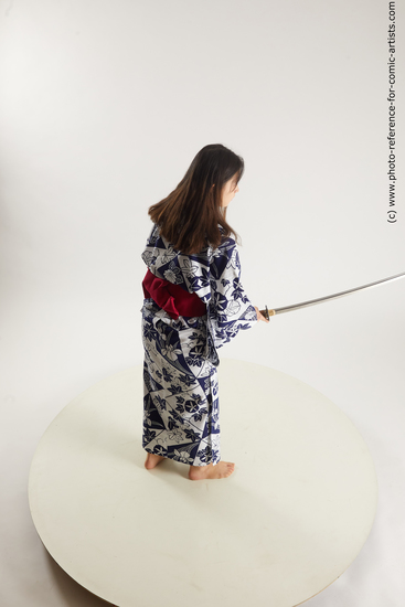 Woman Young Athletic Fighting with sword Asian Costumes