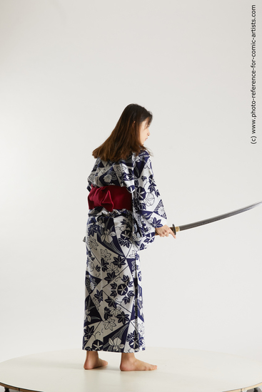 Woman Young Athletic Fighting with sword Asian Costumes