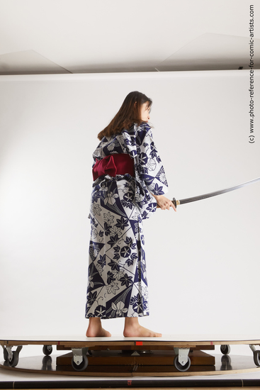 Woman Young Athletic Fighting with sword Asian Costumes