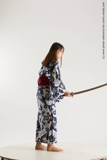 Woman Young Athletic Fighting with sword Asian Costumes